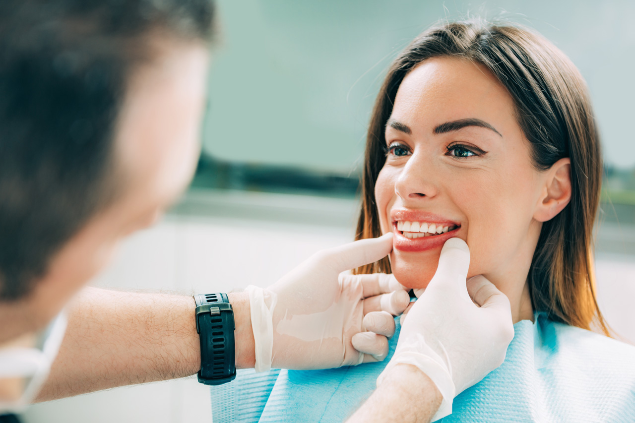 Dentist with female patient