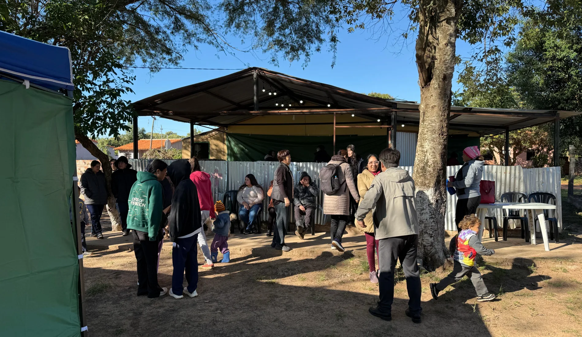 Families wait for free dental care outside the Dentists for Humanity mission clinic in Paraguay